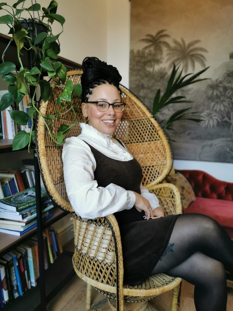 Stephanie Davis sitting on a chair